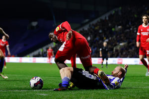 Christian Saydee of Shrewsbury Town and Barry Bannan of Sheffield Wednesday..