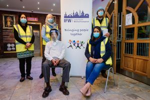 Interfaith Wolverhampton Members Gurdev Kaur Bansal, Jill Parker, Surjit Singh Uppal, Councillor Jasbiner Dehar and Paul Rayner pose at the vaccination centre at Guru Teg Bahadur Gurdwara