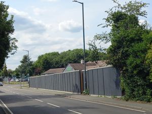 Lidl put in temporary hoardings to secure the site. However, it meant a hedge ended up being replaced, which did not go down well with locals. Picture: LDRS