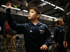 Bullseye Maths is a programme that the PDC have set up for Key Stage 2 students to use darts to help develop their numeracy skills. PDC is currently taking place at the WV Active Aldersley in Wolverhampton this week and darts players Mike de Decker and Jermaine Wattimena come to help out students from Woden Primary School.