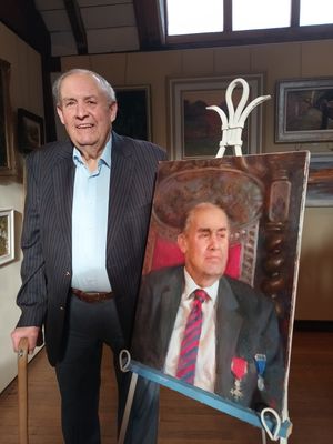 Milner Whiteman OBE with his portrait.
