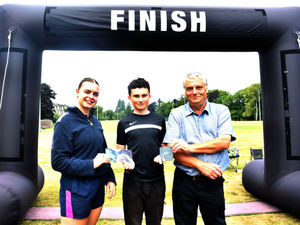 Winner in the 400m swim and 5k run Open 15-18 category - Meuryn Rees with Ellie Shufflebotham of Freedom Leisure, Builth Wells and Builth Wells Deputy Mayor Councillor Alan Waller. Image by Ted Edwards Photography