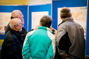 People looking at the plans