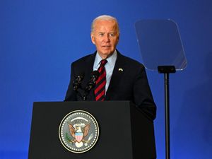 US President Joe Biden delivers a speech from a stage in New York