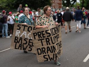 Supporting image for story: White South Africans gather in support of Trump amid claims of racism