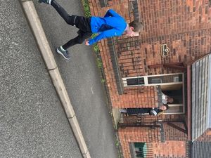 Carter is cheered along as he runs.