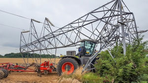 'Look out, look up.' A felled pylon in a farmer's field