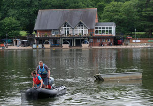 Volunteers out on Llandrindod Wells lake looking for struggling fish