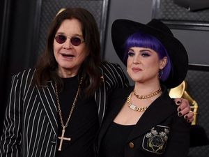 Supporting image for story: Ozzy Osbourne walks the Grammys red carpet with a cane