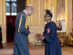 Nikki receives the MBE in October from Prince William. Photo by British Ceremonial Arts.