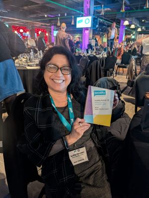 Suffia Perveen, CEO at Ethnic Minority Council, collects Locality's Building Inclusive Communities Award