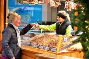Angie Cleaver from Langley sampling some of the produce from trader Campanu Marineza from Romania