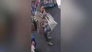 Video grab from CCTV footage showing a woman stealing £400 worth of Jellycat's by stuffing them down her trousers.