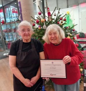 Photo shows (from left to right) Jean Taylor, who is helping in the Town Hall Café today and Liz, who has been selling her cards and calendars in the Thursday weekly market to help raise funds for the Town Hall .  