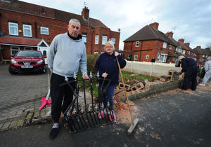 Kevin Williams and his partner Dawn Jones outside their home in Freeman Road, in Wednesbury, after a crash crashed into their wall