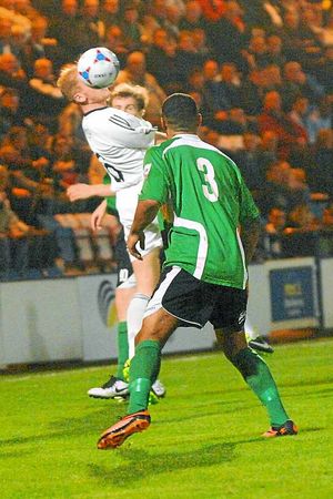 Mike Grogan battles for AFC Telford