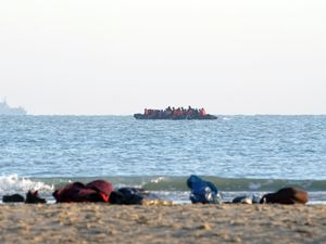 A group of people thought to be migrants, leave the beach in Gravelines, France, onboard a small boat last year