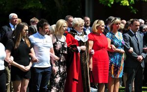 Mayor of Sandwell Cllr Barbara Price arm in arm with family representatives and dignitaries at Friday's silence for the victims