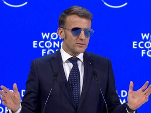 Supporting image for story: ‘Top Gun’ shades for Macron in Davos as he battles eye condition