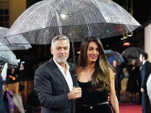 Supporting image for story: George and Amal Clooney brave British rain for screening of The Boys In The Boat