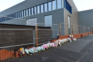 Dozens of flowers have been left at the scene of the fatal crash