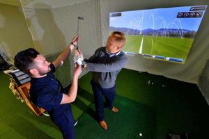 PGA professional Dan Leeke checks out Shropshire Star sports editor Russell Youll's progress and then passes on a few words of advice