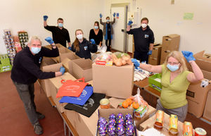 Members of Shropshire Council preparing food parcels at Shropshire Food Enterprise Centre to go out to residents