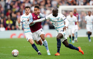 Aston Villa's Jacob Ramsey (centre) battles for the ball with Chelsea's Mason Mount (left) 