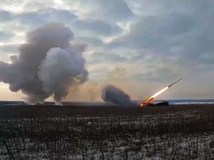 A Russian Army self-propelled 220mm multiple rocket launcher Uragan fires toward Ukrainian position