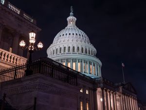 Lights are on inside the Capitol building set aside the night sky in Washington DC on Friday night