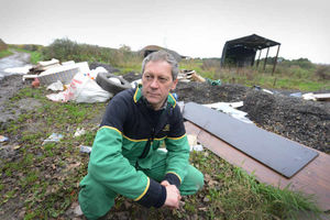 Chris Inett takes a look at rubbish dumped next to his land