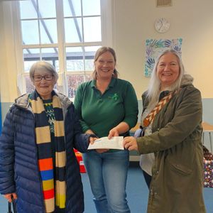 Anne Renshaw and Jenny Birchall two members of the Write Word Group at Whitchurch Food Bank handing over a £1000 for the Charity.