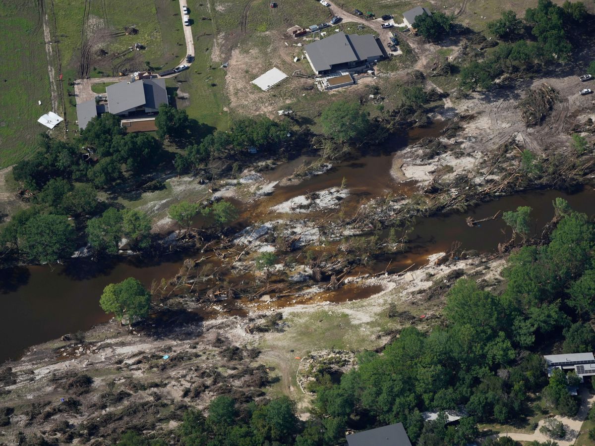 Searchers in helicopters and on horseback scour Texas flood debris for missing