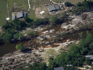 Supporting image for story: Searchers in helicopters and on horseback scour Texas flood debris for missing