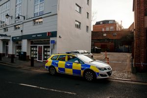The sealed off land is in between Martin Hayes Opticians and Strutt & Parker Estate Agent