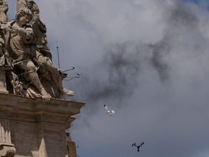 Black smoke billowing from the Vatican
