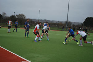 Harborne's defence stretches to block Stourport's attack.