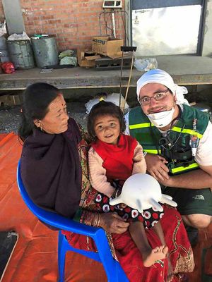 Ed Hullah pictured with Nepali patients he has been helping