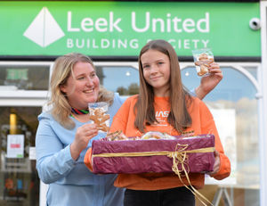 Leek United Heritage Trail winner Izzy Ottolini, aged 12, with staff member Zoe Garrett, at Leek United Building Society, Market Drayton