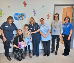 Kaydee with hospital staff who have helped her
