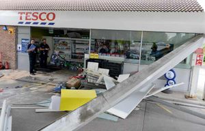 Sand was used to cover fuel from the Jaguar, while the damage to the station was evident in the aftermath of the crash