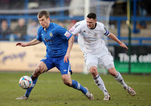 Rhys Oates of Stockport County and Simon Grand of AFC Telford United