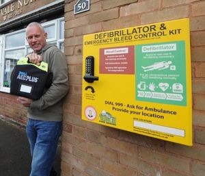 Councillor Stuart Henley with a defibrillator in Halesowen