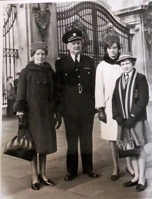 George Goodman received the MBE the same day as The Beatles. He is pictured in uniform outside Buckingham Palace with wife Doris and daughters Jill and Joy (in school uniform). 