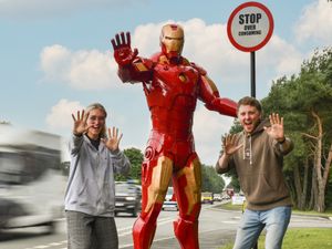 Supporting image for story: Superhero stands firm with recycling message for passers-by