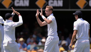 England's Stuart Broad (centre) celebrates taking the wicket of
Australia's Ryan Harris (not pictured)