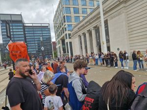 People began to stand near Broad Street, Birmingham, to get a good view of the funeral cortage as it travels past
