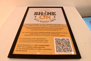 There is a poster which bakery customers can use to donate to the charity Shine On with Harvey Owen