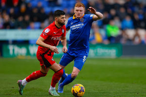 Jordan Jones of Wigan Athletic and Morgan Feeney of Shrewsbury Town (AMA)