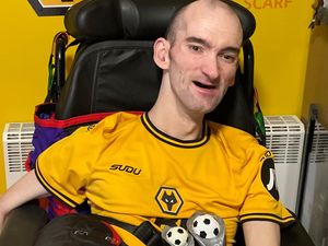 Supporting image for story: Lifelong Wolves fan and former disability wheelchair star never misses a match thanks to care home support